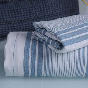 Folded blue and white striped fabric