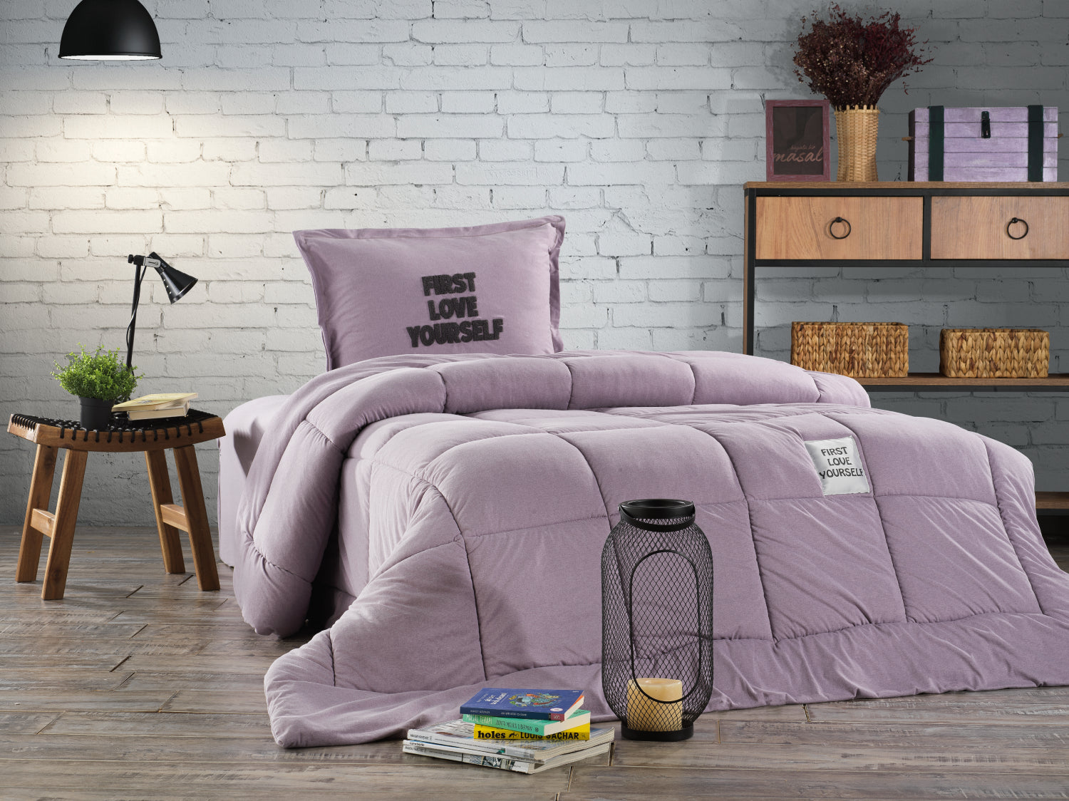 Purple comforter set on a bed with pillows and decor items in a room